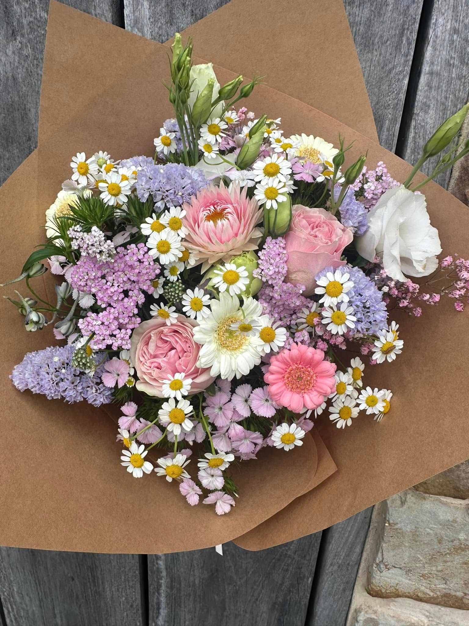 Two Bouquets of Dried Flowers Are Sitting next to some ladies heels — Flowers by Suzanne in Maitland, NSW