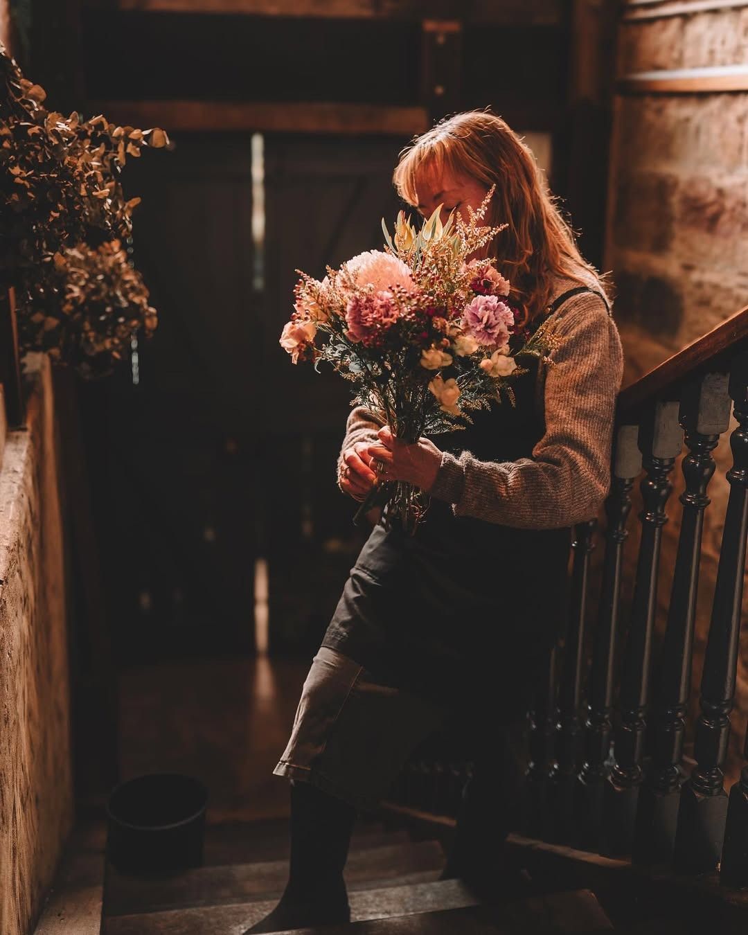 Two Bouquets of Dried Flowers Are Sitting next to some ladies heels — Flowers by Suzanne in Maitland, NSW