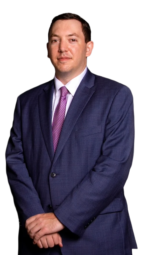 Steven Stieglitz in dark suit and blue tie, arms crossed, looking at the camera.