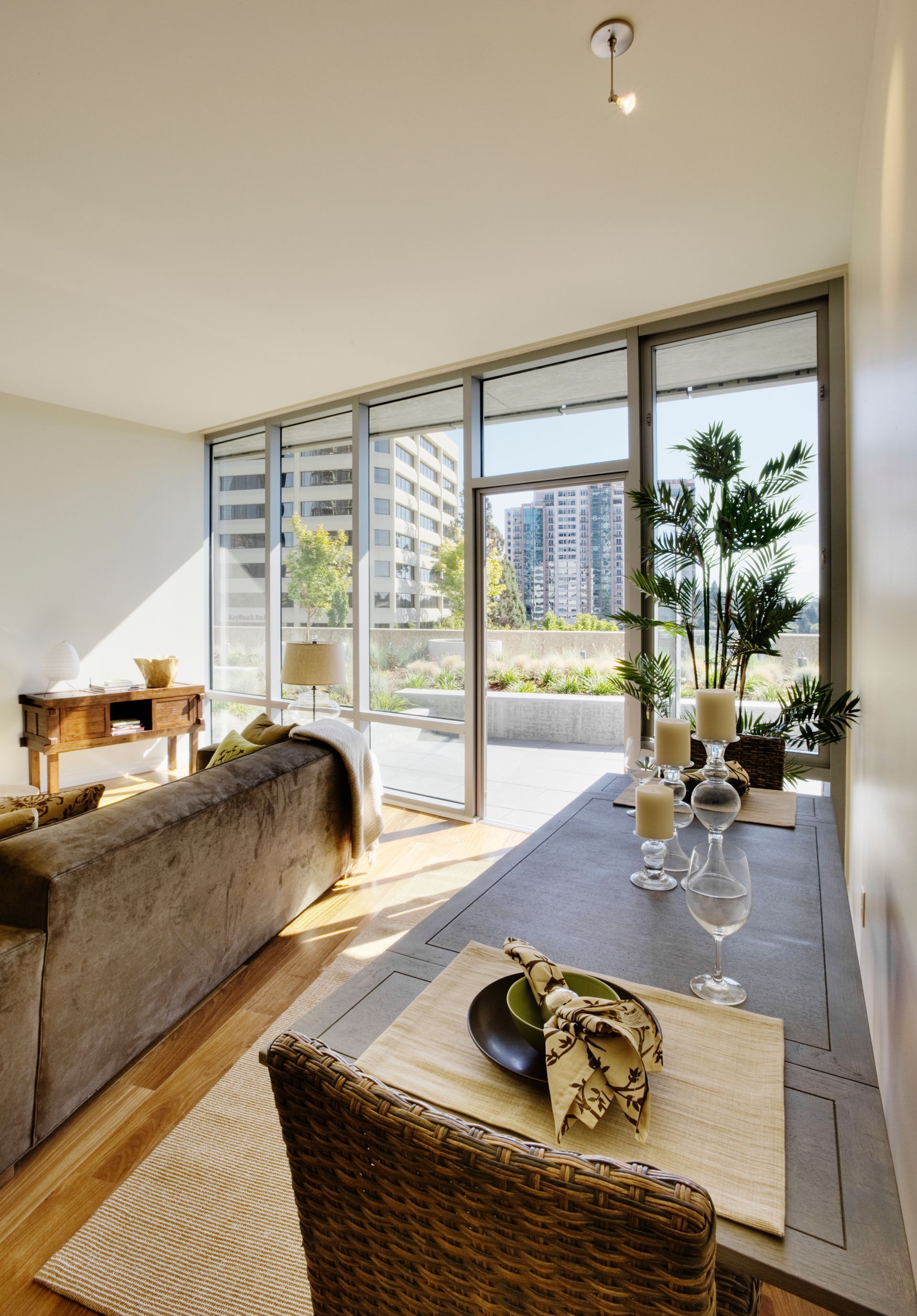 A living room with a couch a table and chairs