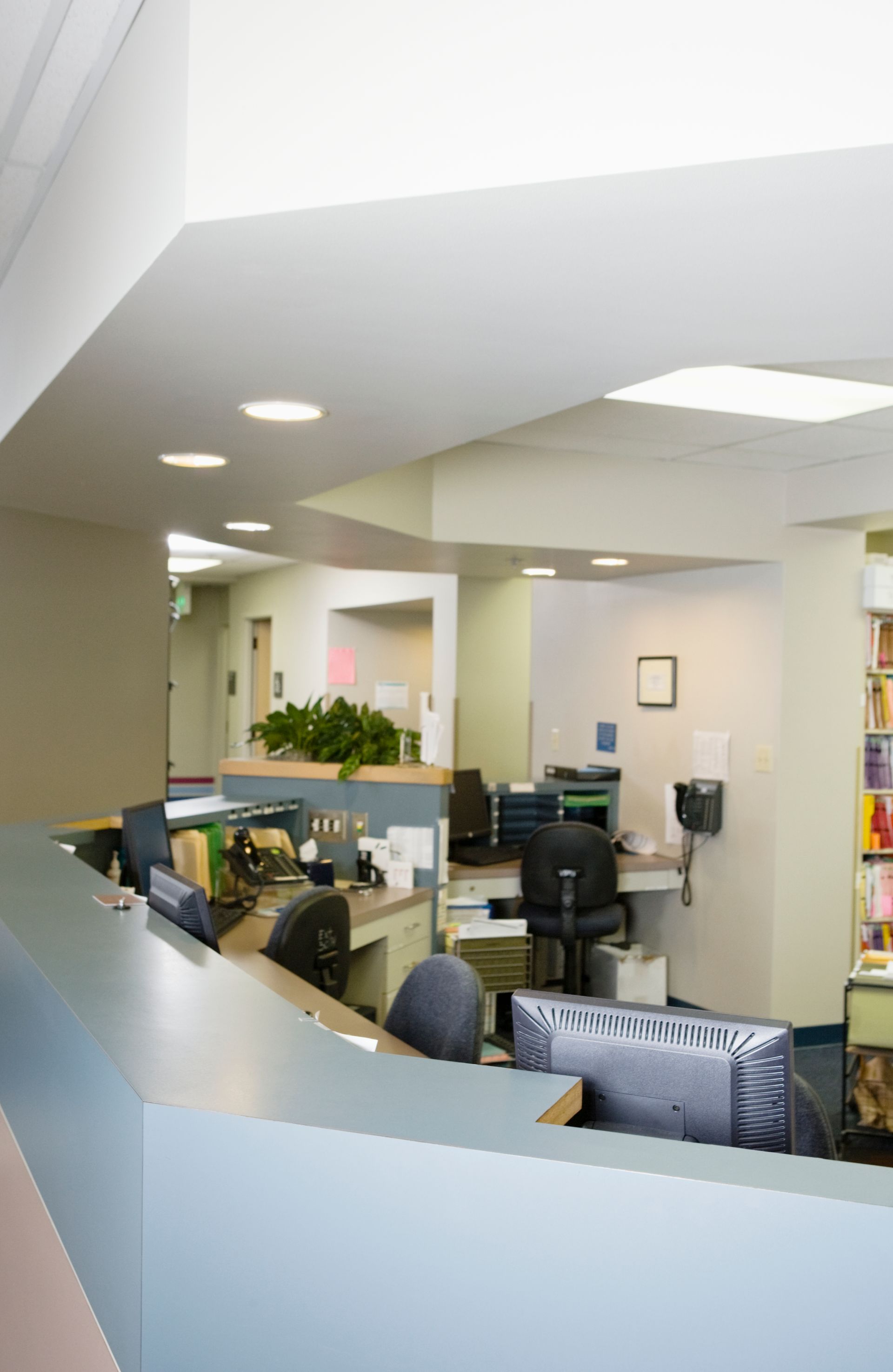 A busy office with lots of desks and chairs
