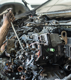 Mechanic working on repair for vehicle engine | Walt's Auto & Electric