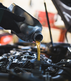 Oil poured into vehicle for oil change | Walt's Auto & Electric