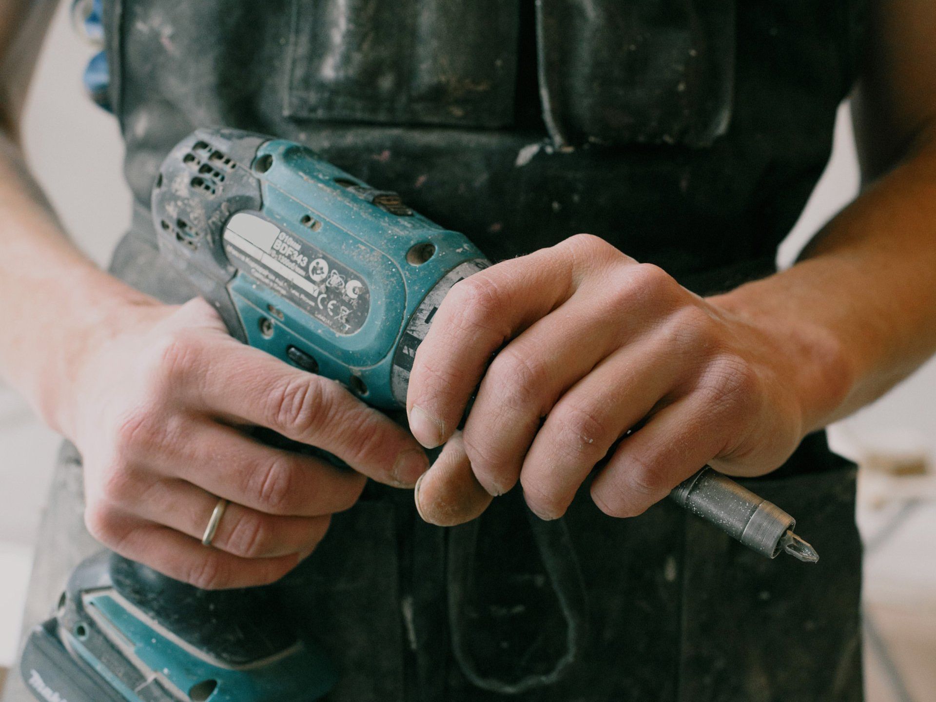 Tradesperson holding a drill