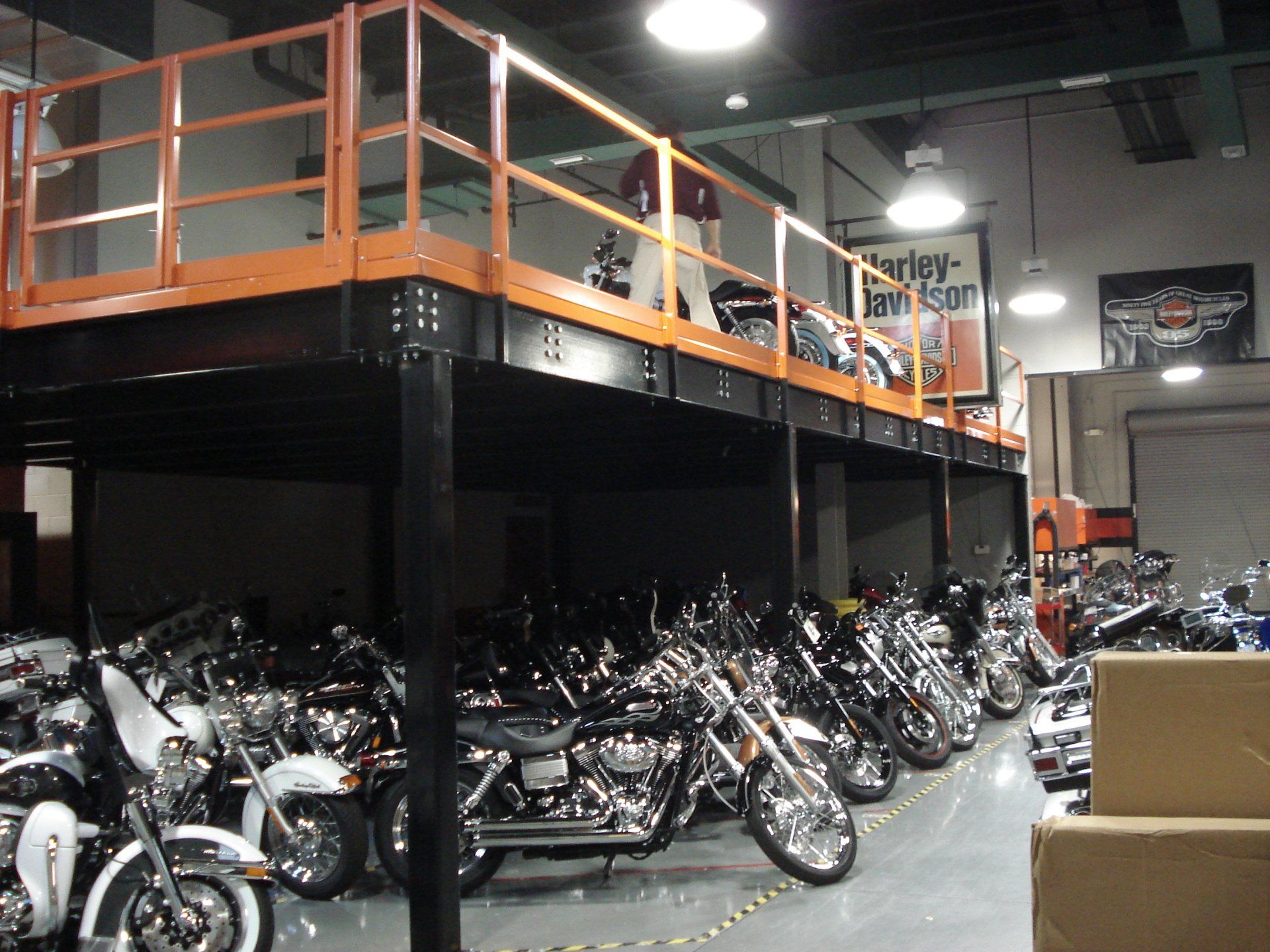 Free standing mezzanine system installed to create second level storage of Harley Davidson Motorcycles