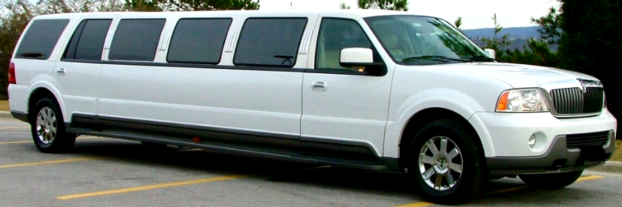 Long white stretch SUV limousine parked in a lot, side view