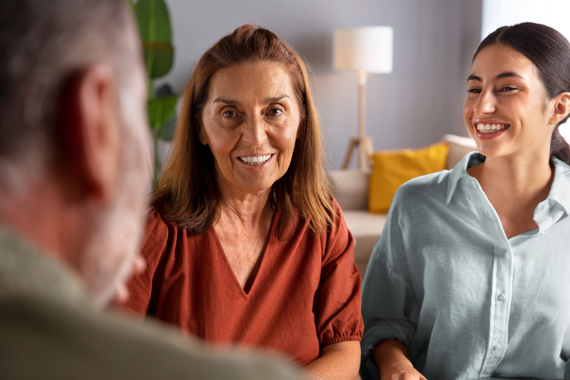 Woman With Red Hair Seated Across a Table From Another Woman — PoDDSS in Ingham, QLD