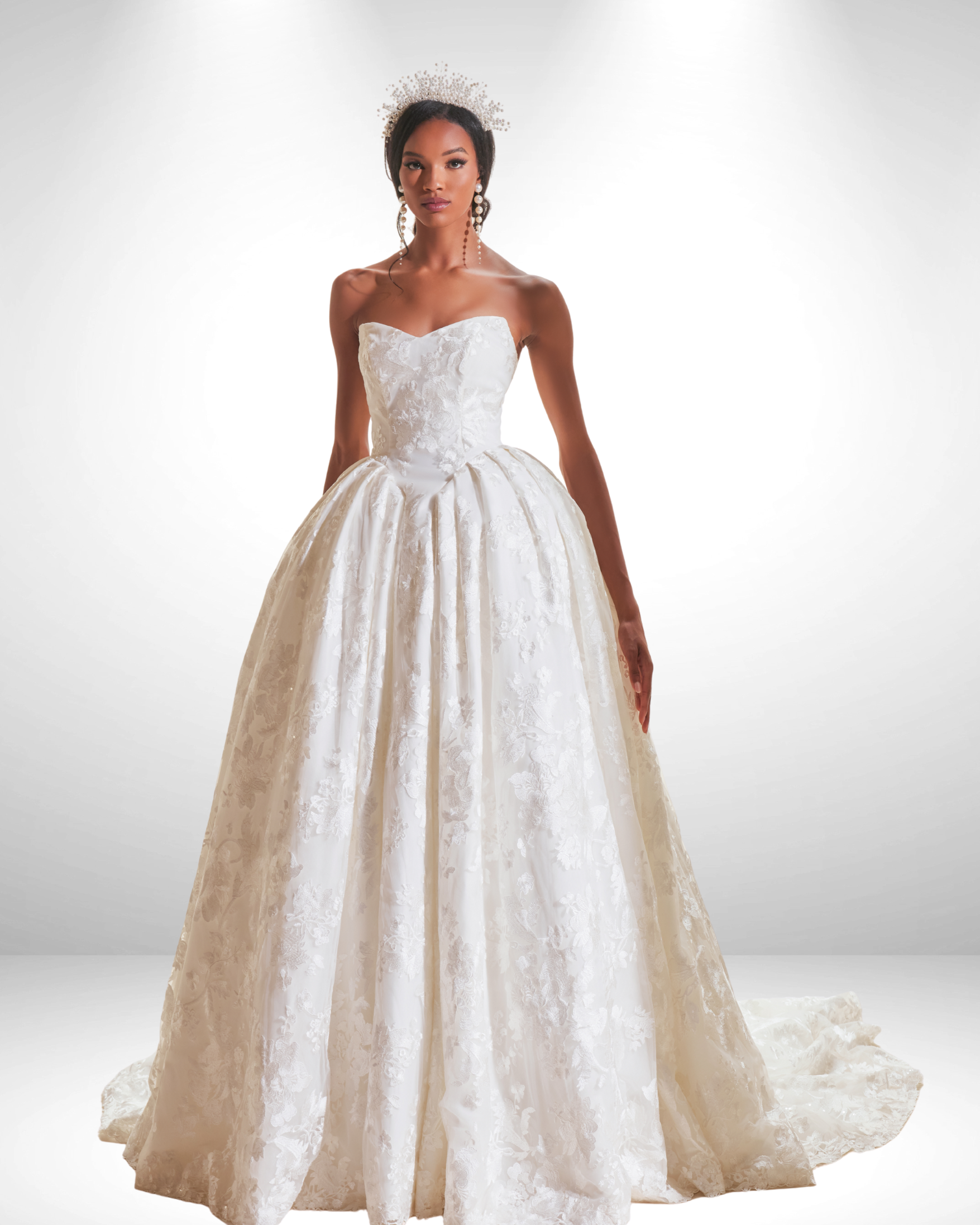 A woman in a wedding dress is standing in front of a building.