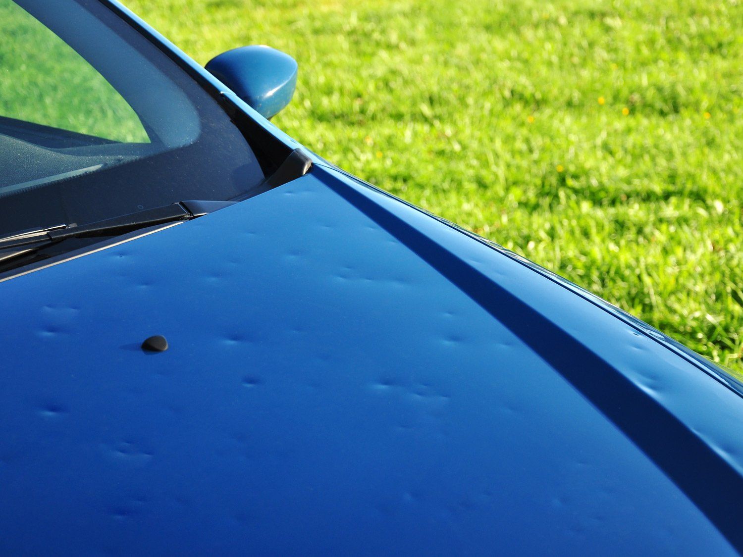 Blue Car Before Dent Repair — Cheyenne, Wyoming — Precision PDR LLC