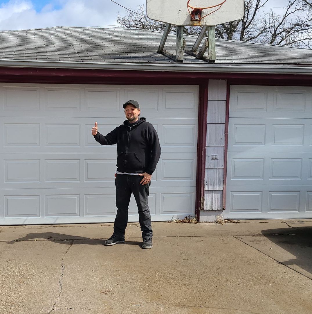 Man Repairing Garage Door | St. Paul, MN | PDQ Garage Door Service