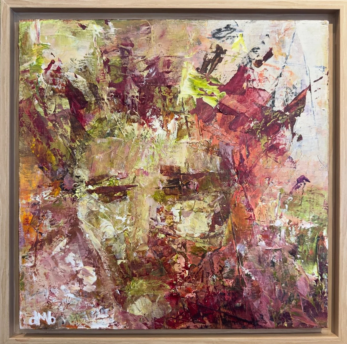 Abstract painting with shades of red, yellow, and green, suggestive of a face within a wooden frame.