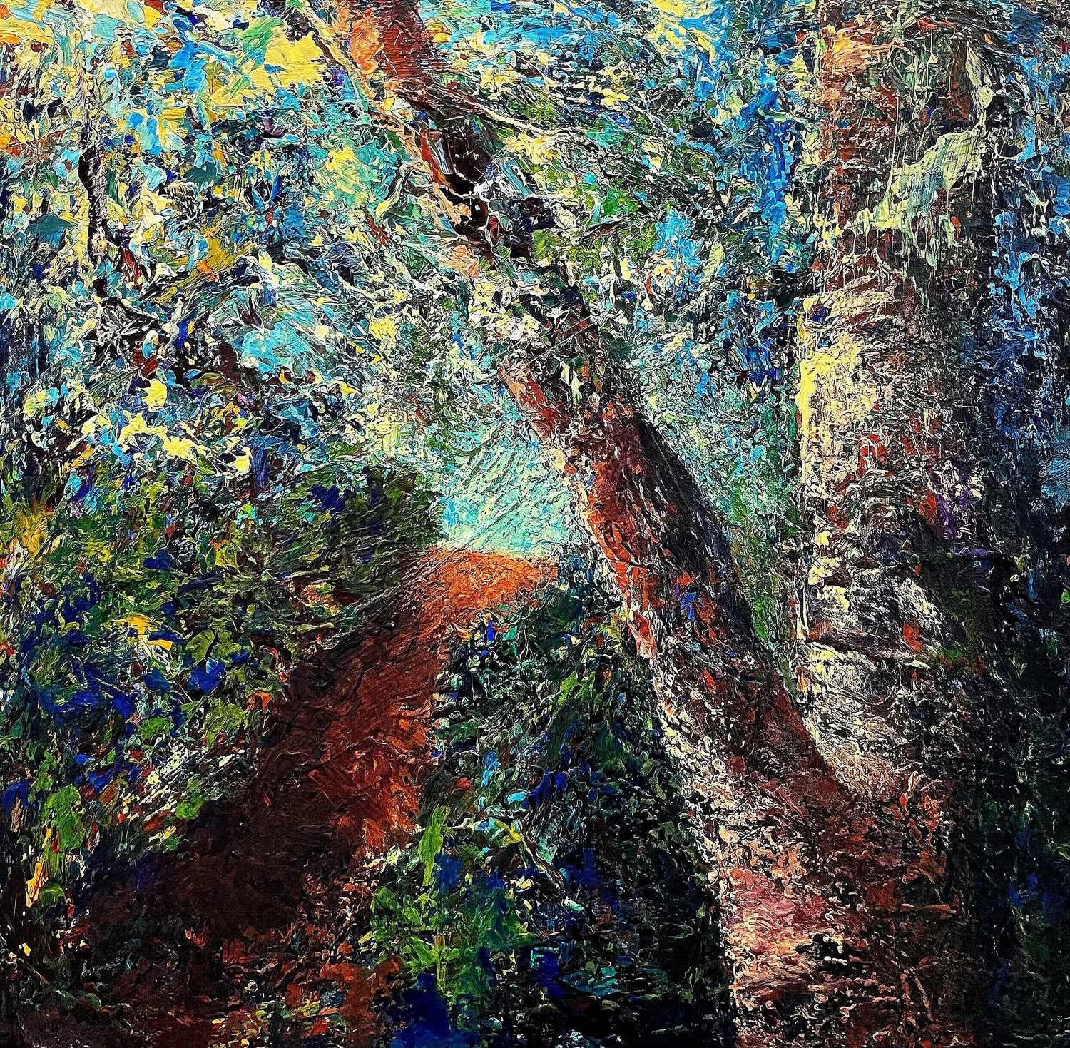 View up through tree trunks, foliage, and sky. Earthy browns and greens contrast with blues and touches of yellow.