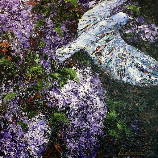 White bird flying near purple flowers and green foliage.