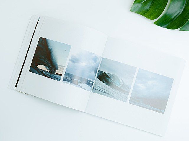 a photo book on a white desk