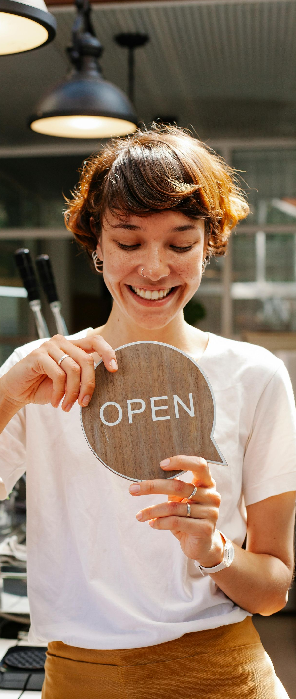 Office interior with reception desk, hallway, and waiting area with sofa.
