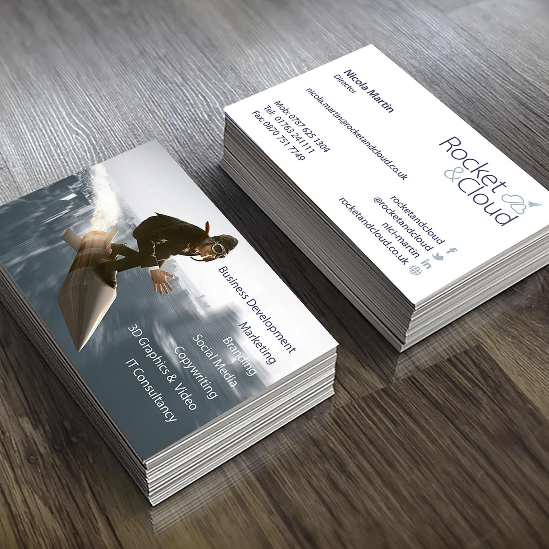Rocket & Cloud business cards on table