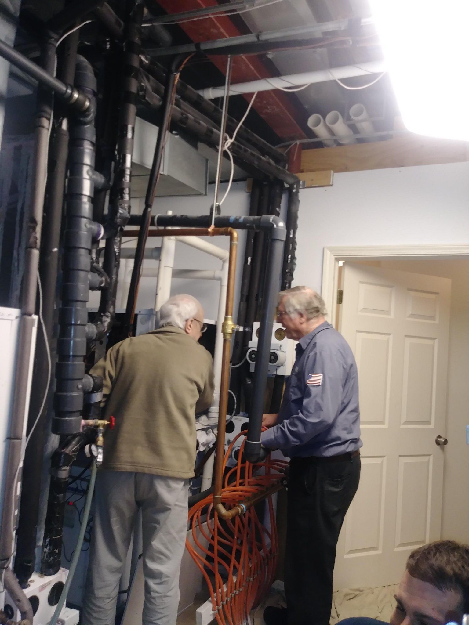 Two Man Checking Heater — Elgin, IL — MDM Heating & Cooling, Inc.