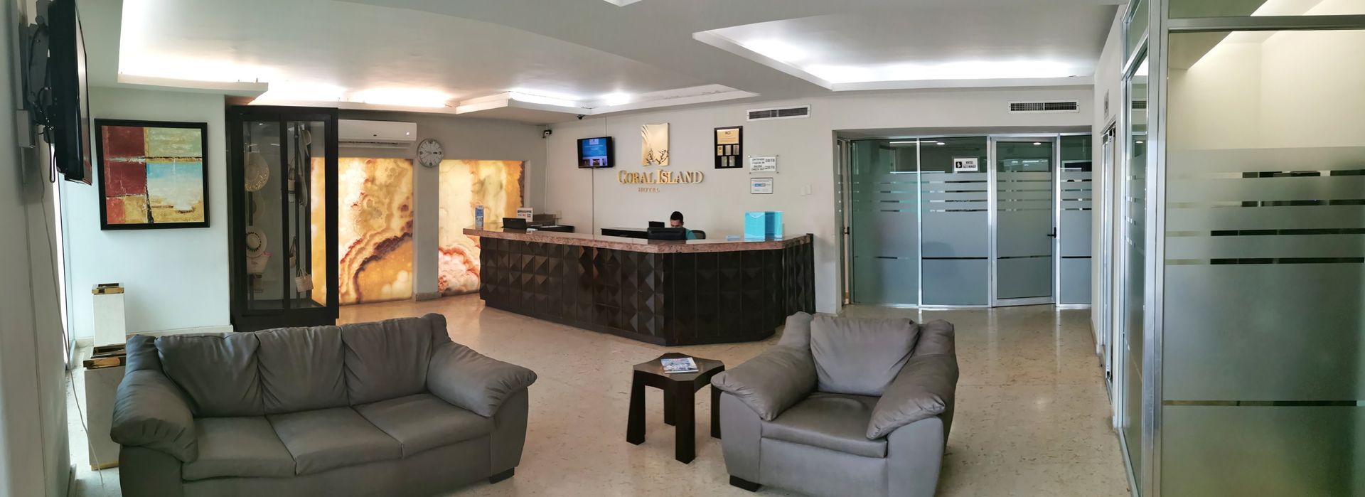 A living room with a couch and chairs in it