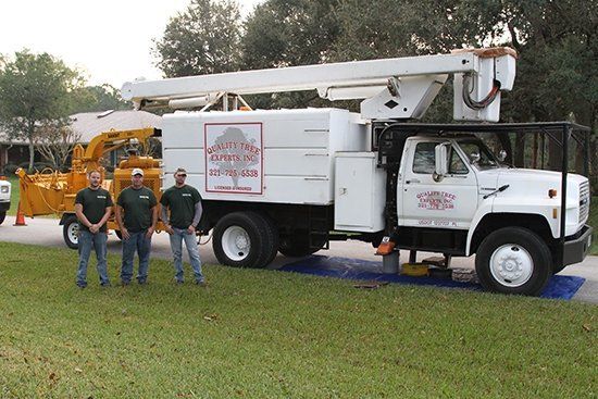 Employee Members and Man Lift Truck | Malabar, FL | Quality Tree Experts Inc.