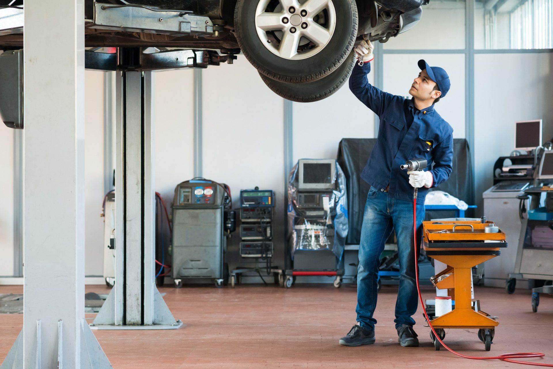 Mechanic At Work In His Garage — Naples, FL — Benz Connection of Naples Inc.