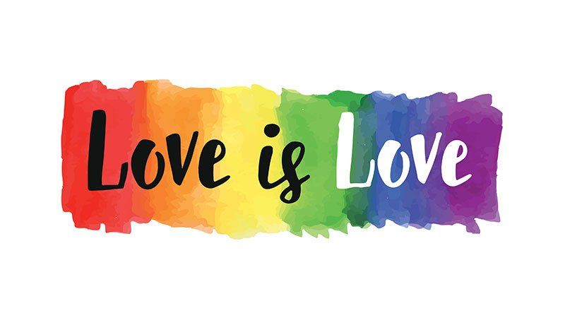 Love is love  written with watercolor rainbow background