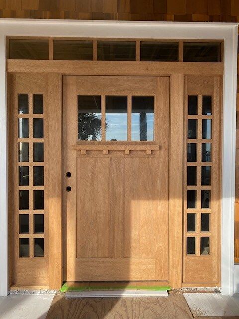 A large wooden door with a lot of windows