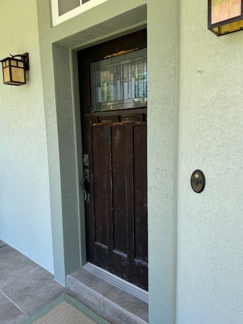 A door with a light on the side of it