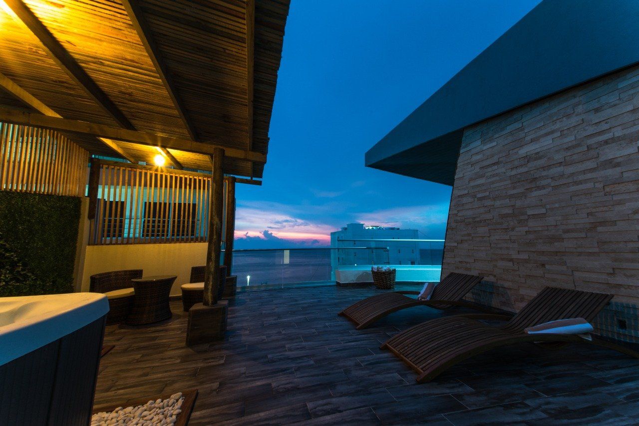 There is a hot tub on the roof of a building.