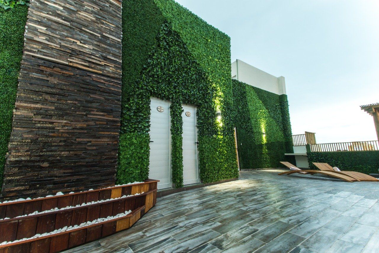 A building with a green wall and a wooden floor