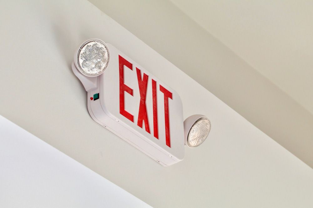 Red and White Exit Sign on Wall for Fast Fire Protection - Newcastle NSW