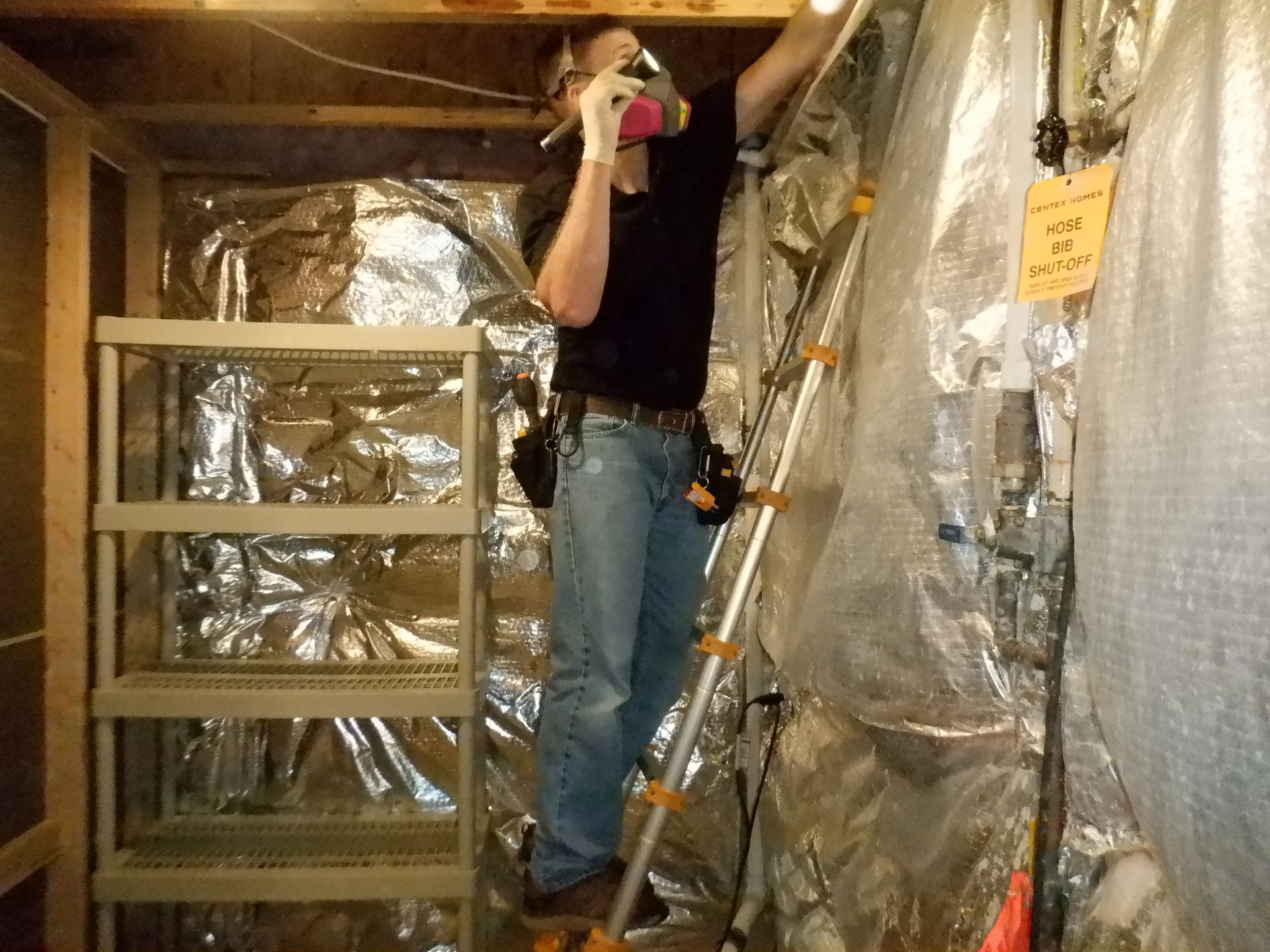 Inspector Dennis Pelczynski inside attic