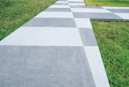 A Concrete Walkway With A Checkered Pattern — Pigot's Midwestern Mini Mix In Orange, NSW