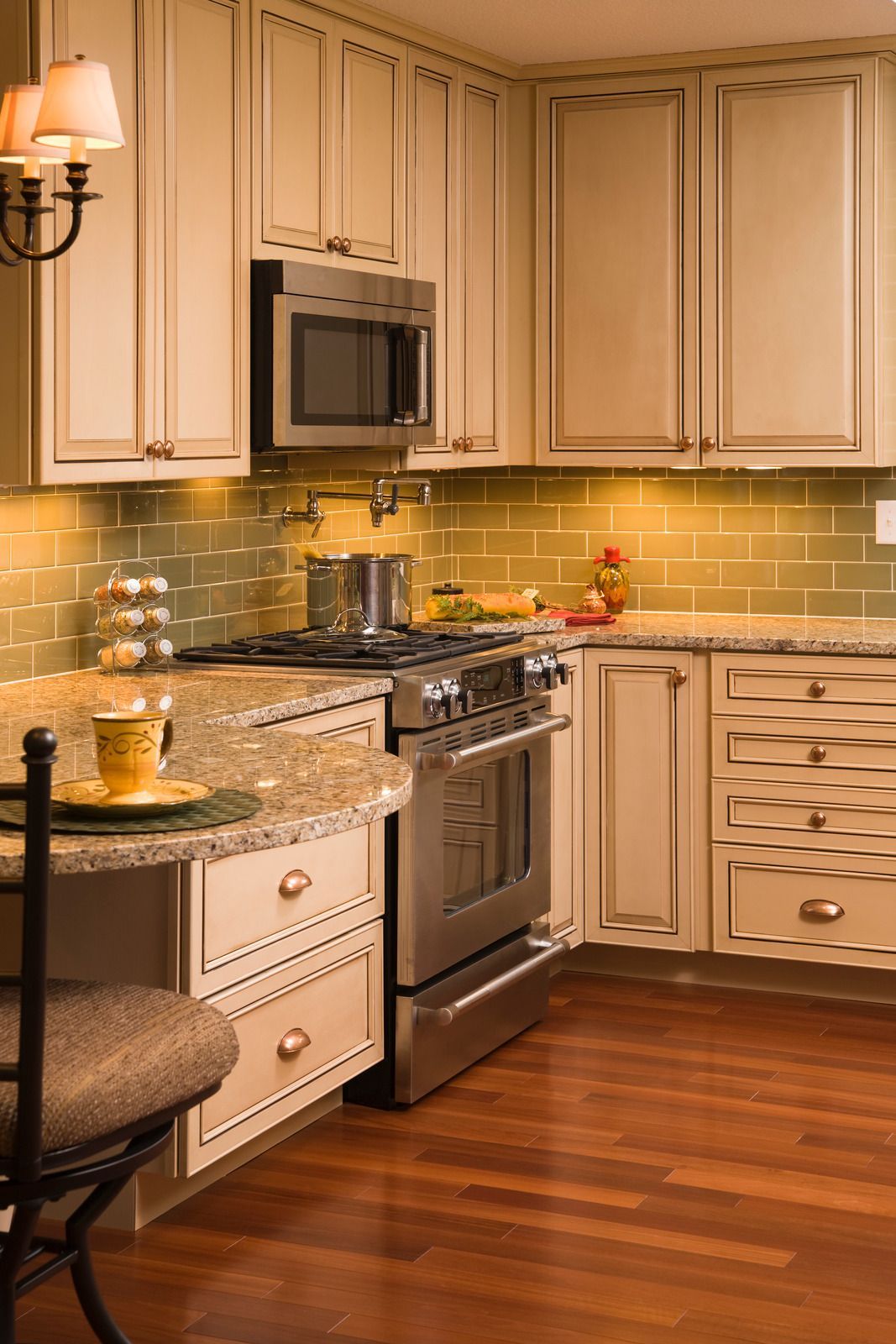 A kitchen with stainless steel appliances and white cabinets