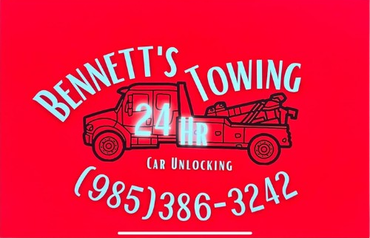 Red sign for Bennett's Towing. Black truck graphic with white text, "(985) 386-3242", "24 hr" and "Car Unlocking".