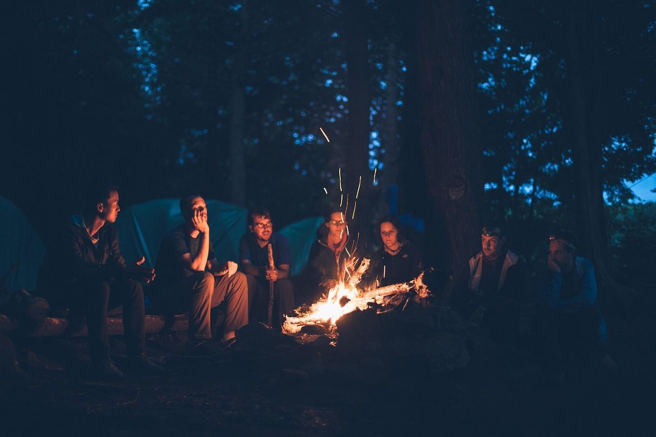 People around a bonfire talking