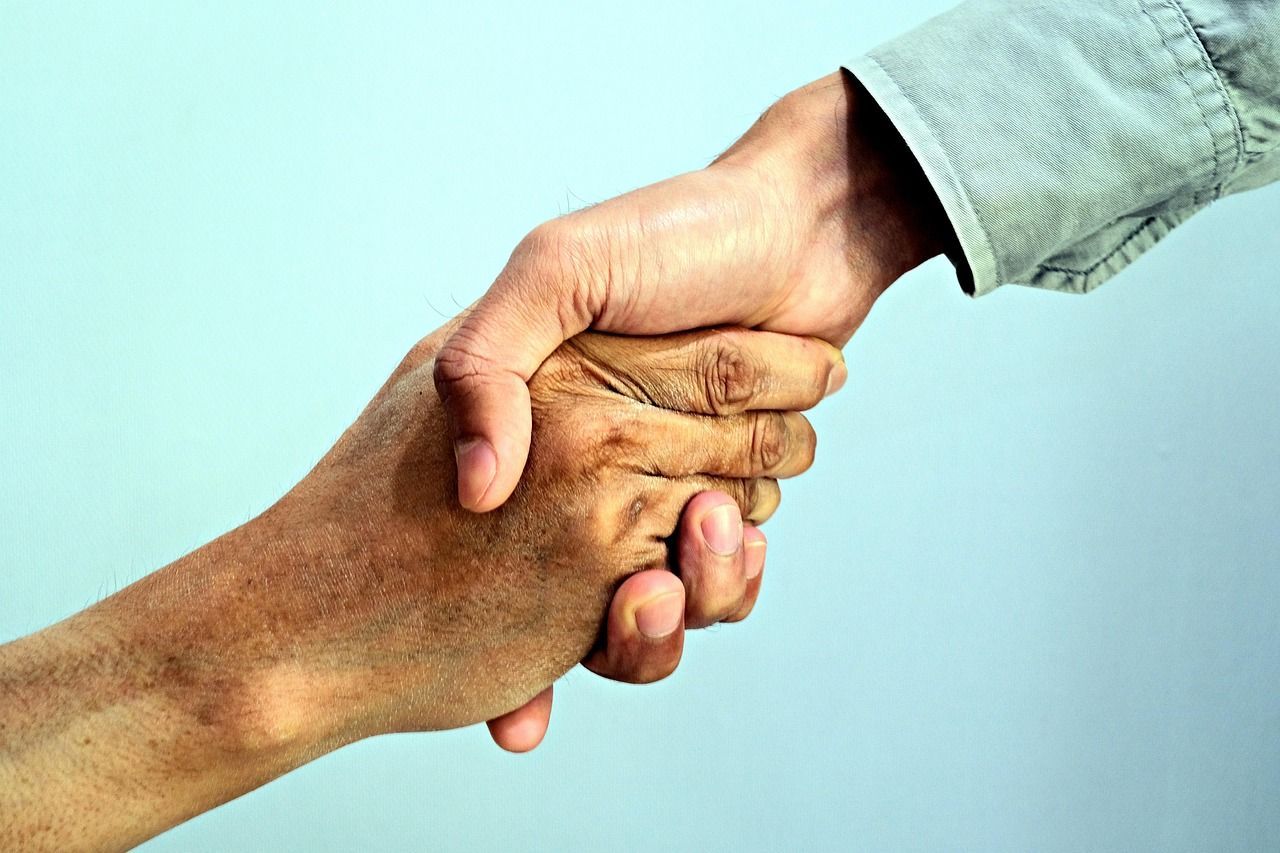 Two people holding hands