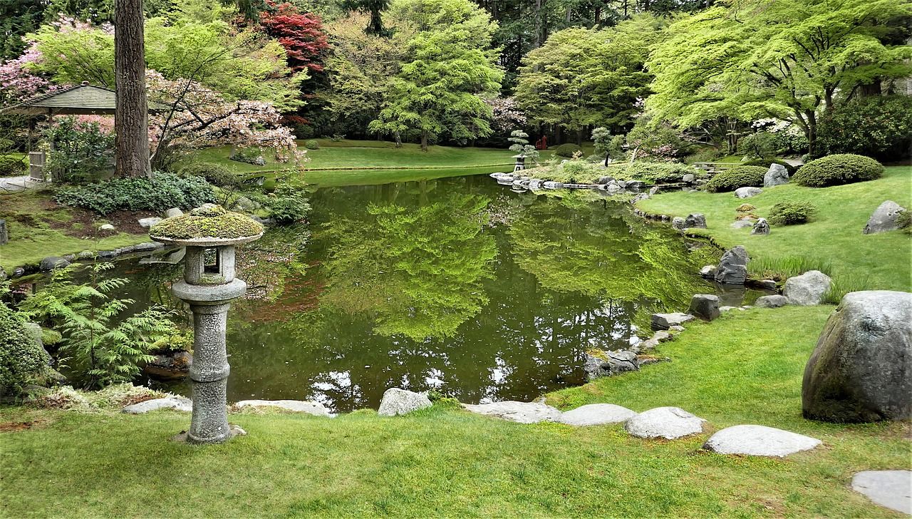Pond in the middle of a garden, with a cute pathway and a fountain