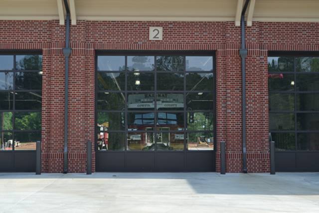 A brick building with a large garage door with the number 2 on it