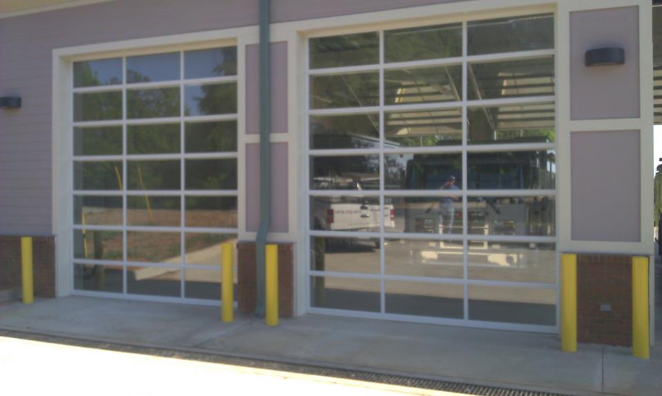 A purple building with a large glass garage door