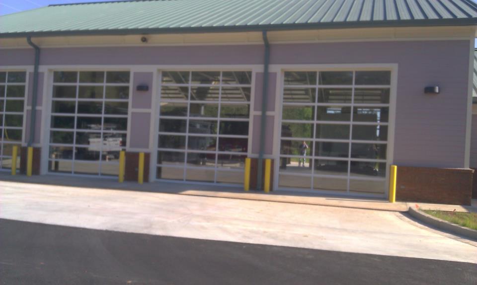 A building with a green roof and a lot of windows