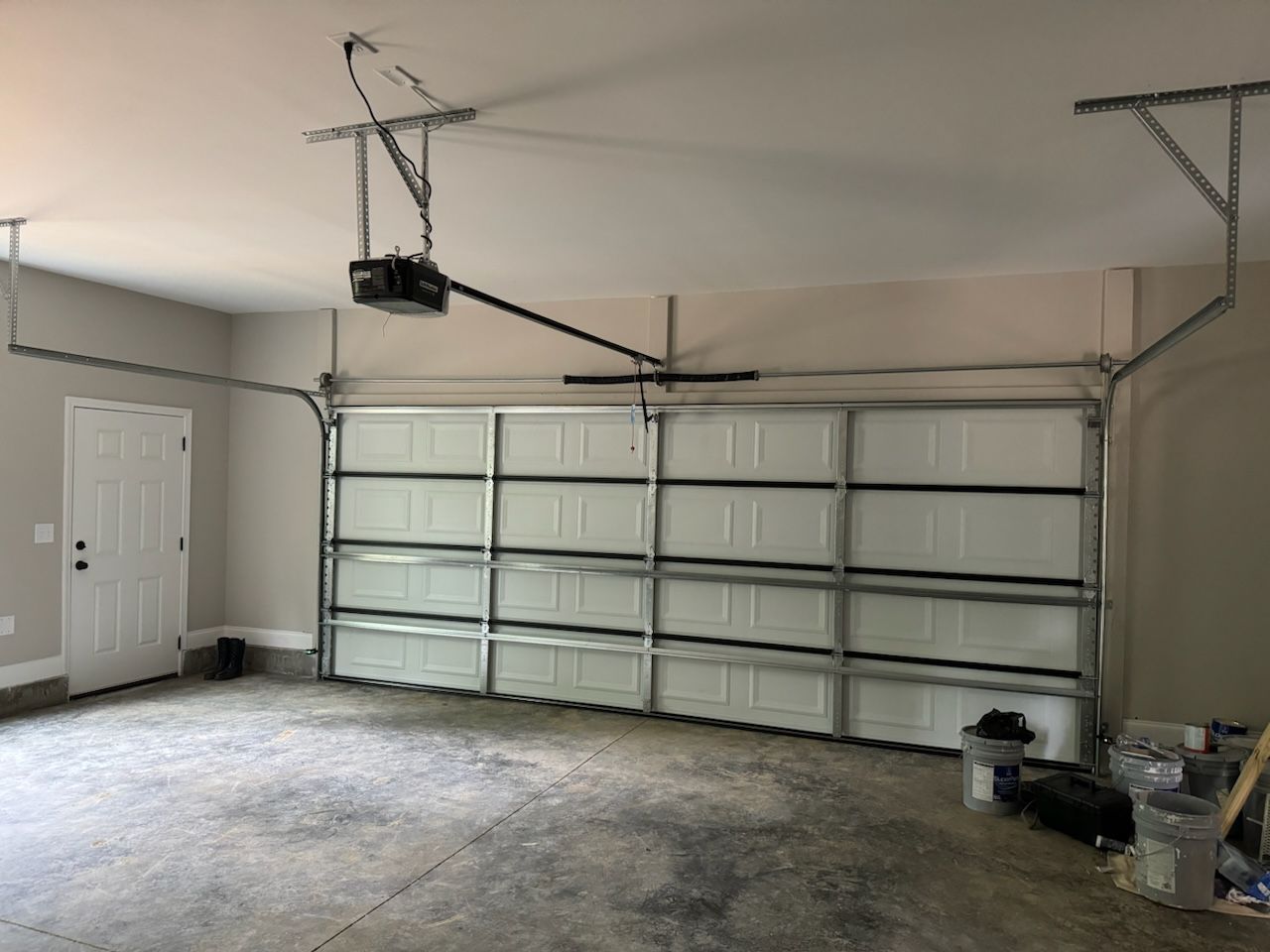 There is a garage door opener in the garage.