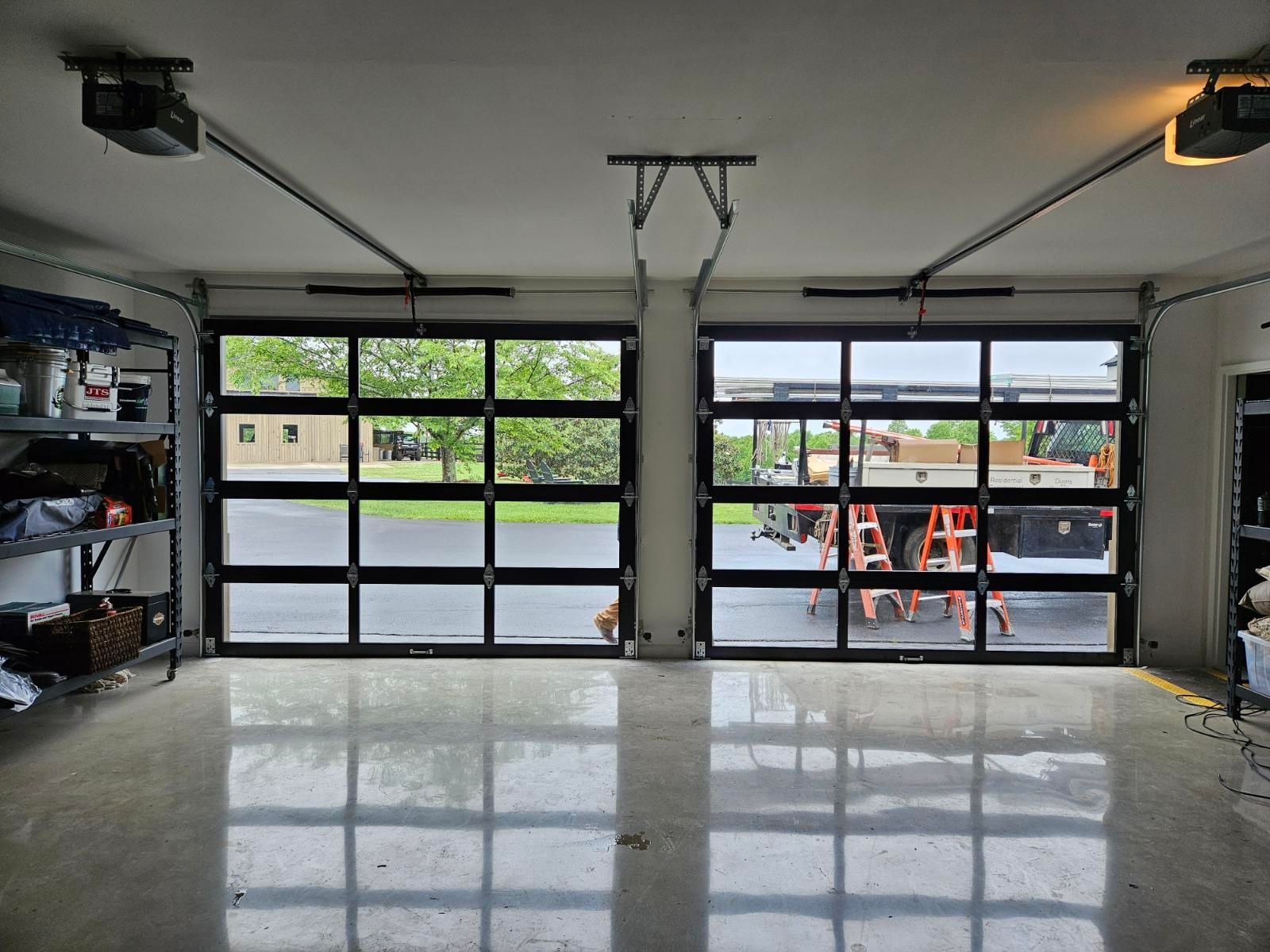 A garage with a large garage door with a lot of windows