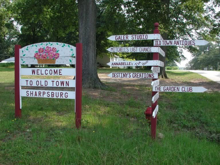 A sign that says welcome to old town Sharpsburg Ga