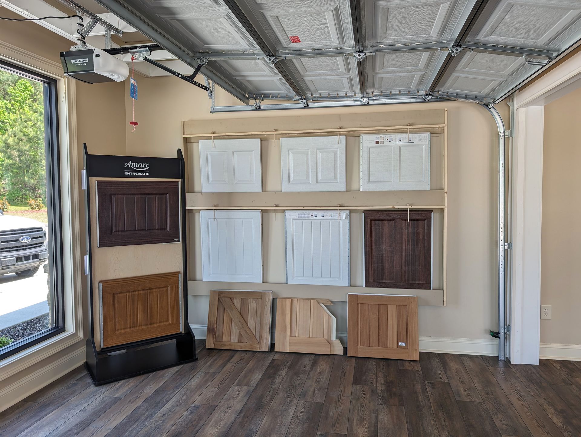 There are many different types of doors on display in this room.