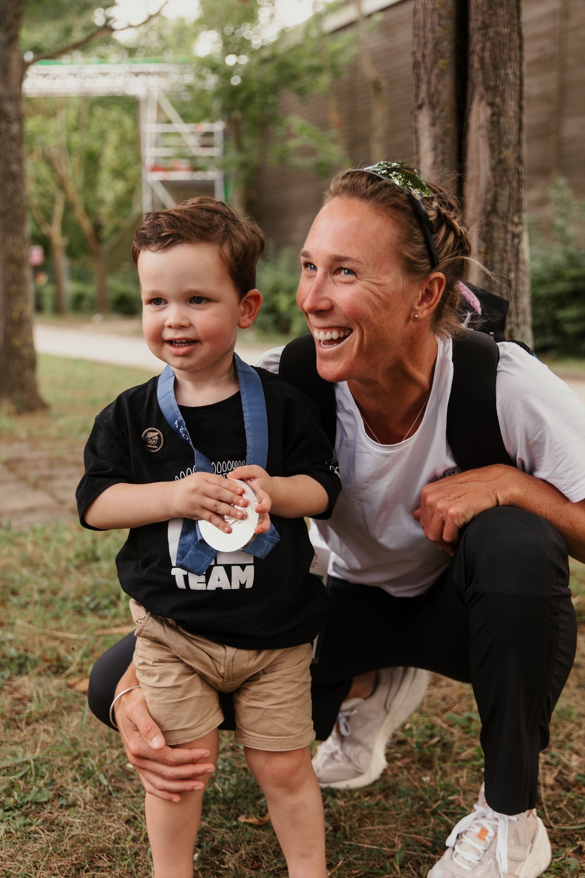 Emma Twigg and son holding Paris silver medal