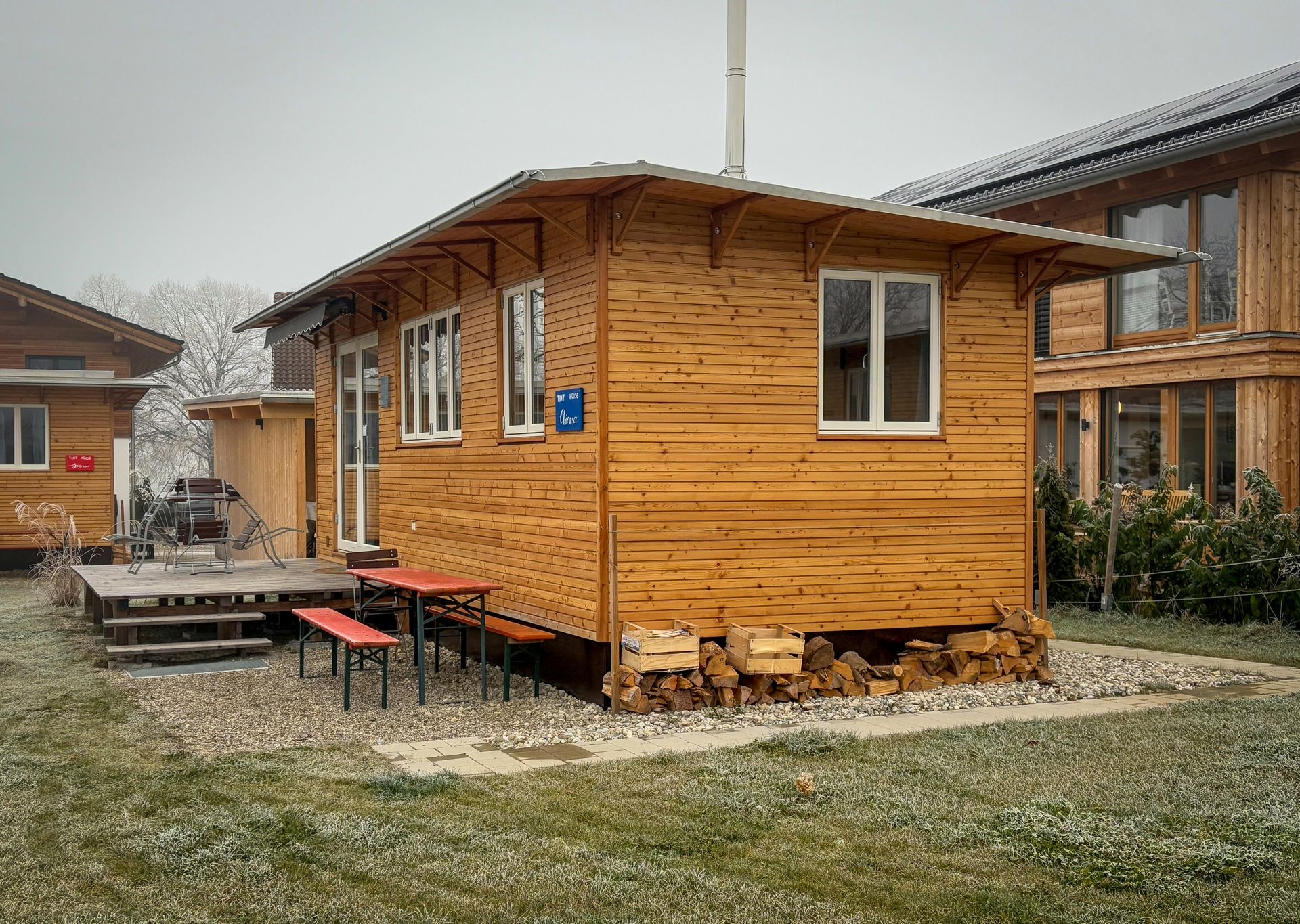 A small wooden house with a handicap sign on the side