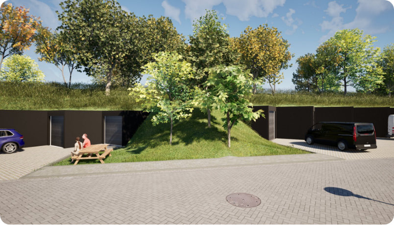 A modern semi-subterranean building with grass-covered roof, parking, and a picnic area outdoors under a blue sky.