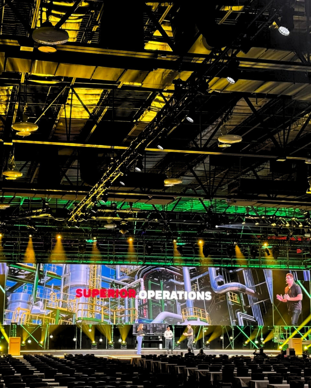 A large stage with a large screen that says super operations
