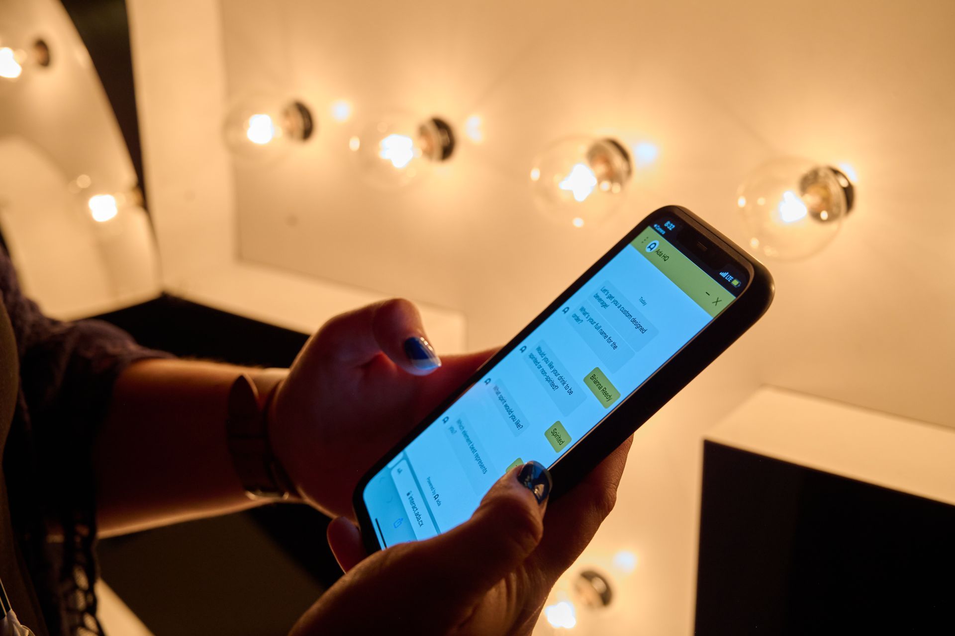 A person is holding a cell phone in their hand.