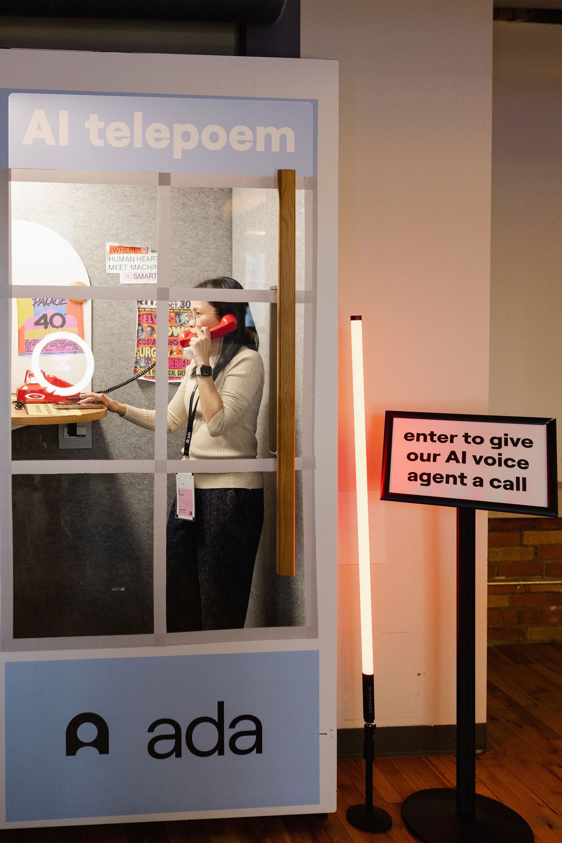 Woman using a red phone in a 